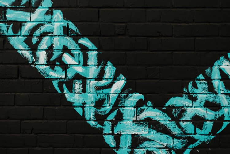 Teal Graffiti on Bricks