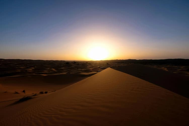 Desert Sunset Over Dunes