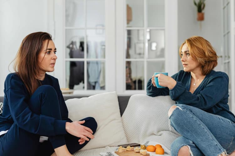 Friends chatting on couch