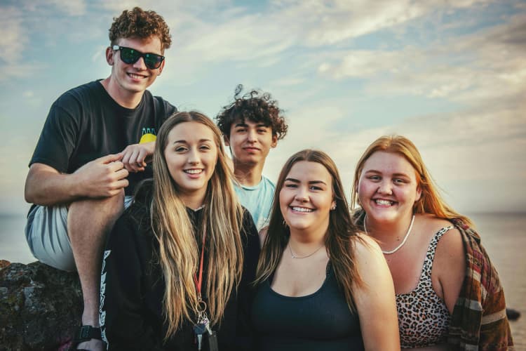 Joyful friends at sunset