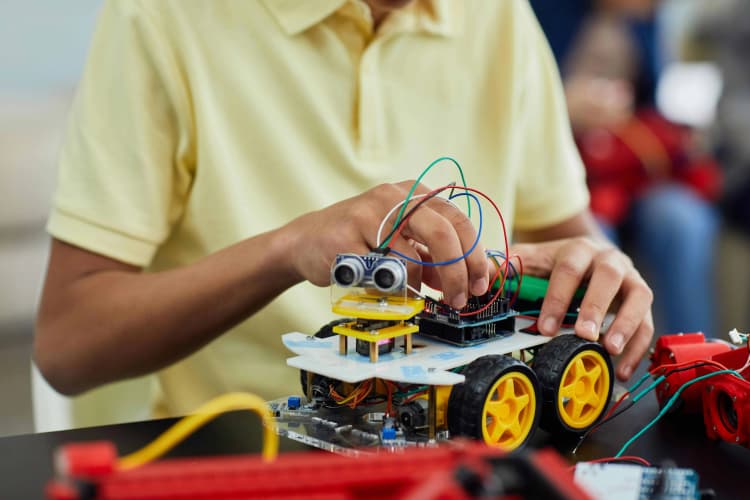 Child Building Robot Car