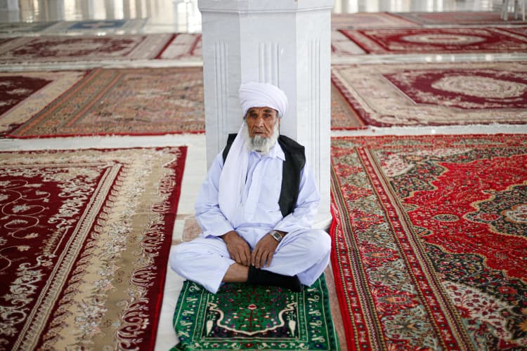 Elder in Mosque Interior